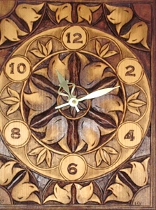 Hand Carved Clock with flowers with chip carved corners.